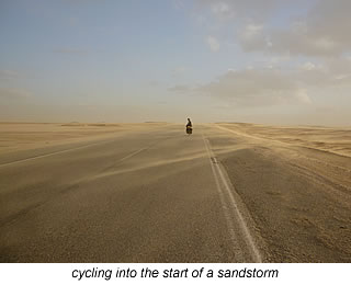 cycling into the start of desert sandstorm in Egypt